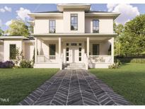 Two-story house with front porch, herringbone driveway, and landscaped lawn at 1245 Golfers Vw, Pittsboro, NC 27312