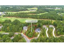 Aerial view of house lot with surrounding golf course and houses at 9 High Ridge Ln, Pittsboro, NC 27312