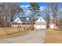 Brick ranch house with attached garage and shed at 101 Creekside Dr, Selma, NC 27576