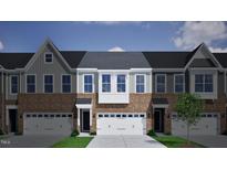 3-story townhome with brick and siding, 2-car garage, and a modern design at 1012 Westerland Way # 201, Durham, NC 27703