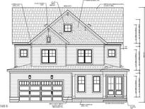 Two-story home with a front-facing garage and classic design at 2517 Lillian Woods Way, Wendell, NC 27591
