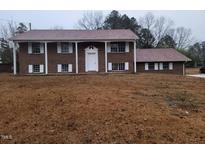 Brick ranch house with attached garage and large yard at 1815 Bethlehem Rd, Rocky Mount, NC 27803