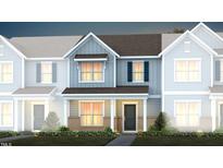 Two-story townhome with gray siding, brick accents, and a charming front porch at 391 Fosterton Cottage Way, Raleigh, NC 27603