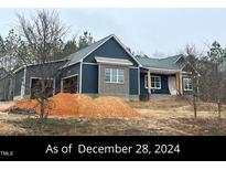 Newly constructed home with gray siding and brick accents at 10 Beauview Way, Zebulon, NC 27597