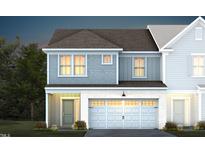 Two-story townhome with gray siding, white trim, and a two-car garage at 295 Broomside Ave, Raleigh, NC 27603
