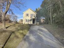 Two-story house with driveway and basketball hoop at 311 Burnette St, Durham, NC 27707