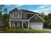 Two-story home with gray and brown siding, white garage door, and landscaping at 117 Hickory Grove Dr, Sanford, NC 27330