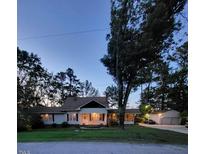 Charming two-story home with large front porch and mature trees at 1521 Cross Link Rd, Raleigh, NC 27610