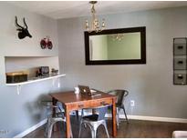 Bright dining area with a table and chairs, hardwood floors, and a built-in shelf at 807 W Trinity Ave # 241, Durham, NC 27701