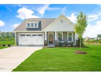 Charming craftsman style home with a two-car garage and nicely landscaped lawn at 1833 Ballard Rd # Clayton Craftsman, Fuquay Varina, NC 27526