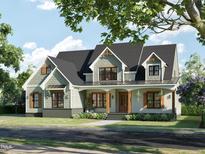Two-story craftsman style home with gray siding, shutters, and a covered porch at 30 Hidden Lake Dr, Franklinton, NC 27525