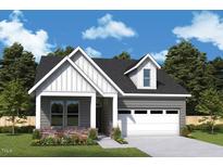 Gray two-story house with white accents and a two-car garage at 423 Imagine Way, Pittsboro, NC 27312