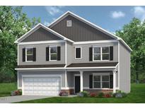 Two-story house with gray siding, white garage door, and landscaping at 71 Victory View W Ter, Smithfield, NC 27577