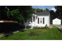 Charming one-story home with a well-manicured lawn at 1631 Granville St, Burlington, NC 27215