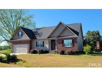 Brick and shingle ranch home with two-car garage at Lot 37 Long St, Broadway, NC 27505