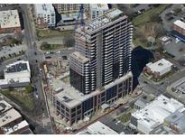 Aerial view of a modern high-rise building under construction at 400 W Main St # 2202, Durham, NC 27701