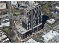 Aerial view of a modern high-rise building under construction at 400 W Main St # 2402, Durham, NC 27701