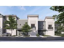 Modern three-unit building with attached garages and balconies at 611 Walnut Hts Dr # 103, Raleigh, NC 27610