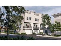 Modern three-story townhome with attached garage and private balcony at 1317 Garner Rd # 103, Raleigh, NC 27610