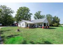 Charming house with a carport and large grassy yard at 10782 S Nc 62 Hwy, Burlington, NC 27217