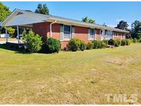 Ranch style brick home with carport and large yard at 2164 Ray Rd, Spring Lake, NC 28390