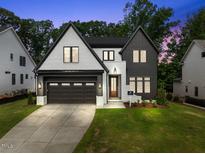 Two-story modern home with dark trim at 5307 Dixon Dr, Raleigh, NC 27609