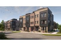 Modern 3-story townhouses with brick and fiber cement panel exterior at 714 Chatham View Rd # 17, Cary, NC 27511