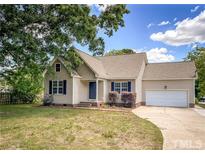 One-story house with attached garage and front yard at 1309 S 11Th St, Lillington, NC 27546