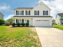 Two-story house with a large front yard and driveway at 218 Mayors Ln, Wendell, NC 27591