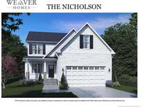 Two-story home with white siding, gray roof, and a two-car garage at 53 Hillwood Dr, Sanford, NC 27332