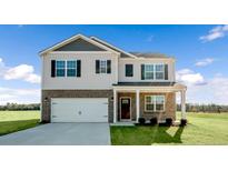 Two-story house featuring brick and siding, a large garage, and a covered porch at 77 Finsbury Ct, Lillington, NC 27546