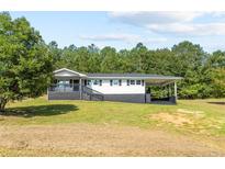 Newly renovated home with carport and porch at 2470 Wire Rd, Erwin, NC 28339