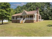 Ranch house with large yard and front porch at 4411 Nc 87 S Hwy, Sanford, NC 27332