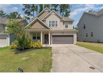 Two-story house with gray siding and a brown garage door at 654 Stapleford Ln, Fuquay Varina, NC 27526