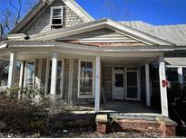 Two-story home with wrap-around porch at 410 S Fayetteville Ave, Dunn, NC 28334