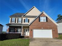 Brick two-story house with a two-car garage at 420 Lenoir Dr. N Dr, Spring Lake, NC 28390
