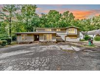 Two-story house with attached garage and landscaping at 1634 Stonegate N, Sanford, NC 27332