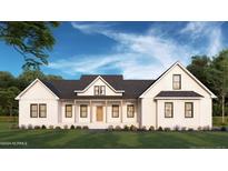 Modern farmhouse exterior with large windows and a covered porch at Tbd 1 Cedar Lane Rd, Sanford, NC 27332