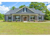 Gray farmhouse-style home with a front porch at Tbd 2 Cedar Lane Rd, Sanford, NC 27332