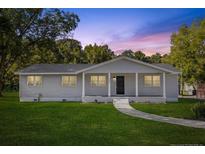 Newly renovated single story home with a covered front porch at 712 Blount St, Smithfield, NC 27577