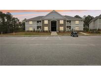 Two-story apartment building with ample parking and landscaping at 260 Gallery Dr # 303, Spring Lake, NC 28390