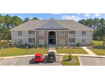 Apartment building with ample parking and landscaping at 240 Gallery Dr # 304, Spring Lake, NC 28390