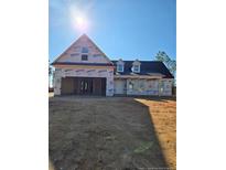 Newly constructed home with gray roof and vinyl siding at 102 Onslow Ct, Spring Lake, NC 28390