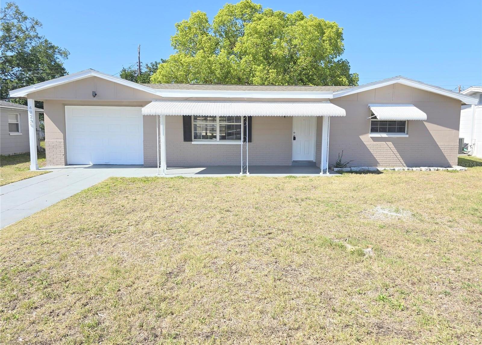 Photo one of 4823 Blossom Dr Holiday FL 34690 | MLS R4908976