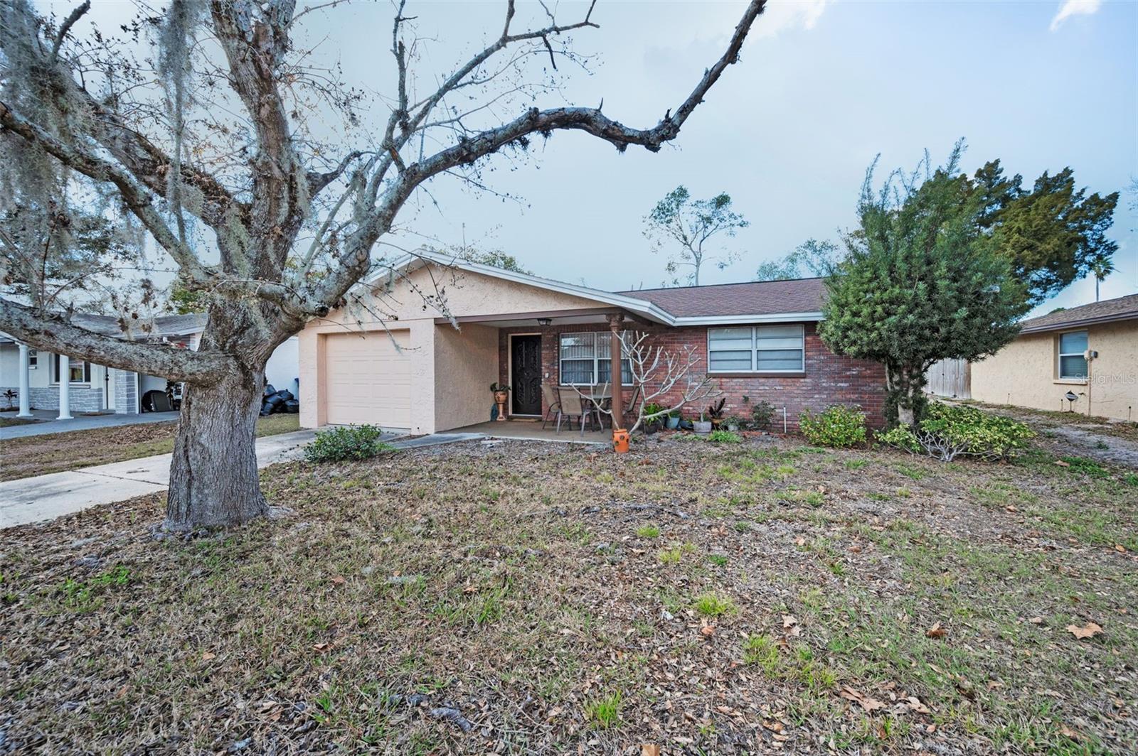 Photo one of 8715 Robilina Rd Port Richey FL 34668 | MLS W7872508