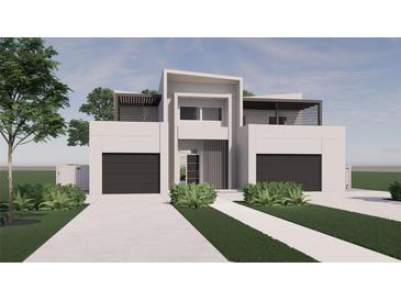 Modern house exterior with two-car garage and landscaping at 2733 S East Ave, Sarasota, FL 34239