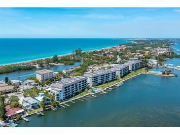 Aerial view of waterfront condo building at 9011 Midnight Pass Rd # 228, Sarasota, FL 34242