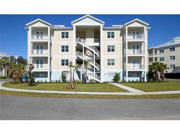 Three-story building with multiple units, balconies, and landscaped grounds at 3426 79Th Street W Cir # 202, Bradenton, FL 34209