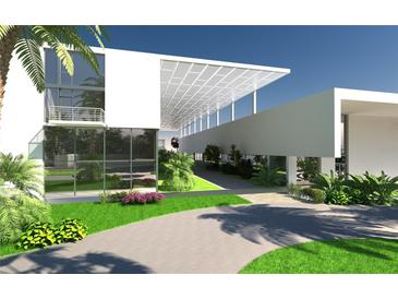 Modern building exterior with landscaping and walkway at 2170 Robinhood Street # C1-312, Sarasota, FL 34231