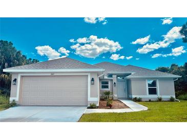 Newly constructed one-story home featuring a neutral color palette and a two-car garage at 2665 Ensenada Ln, North Port, FL 34286